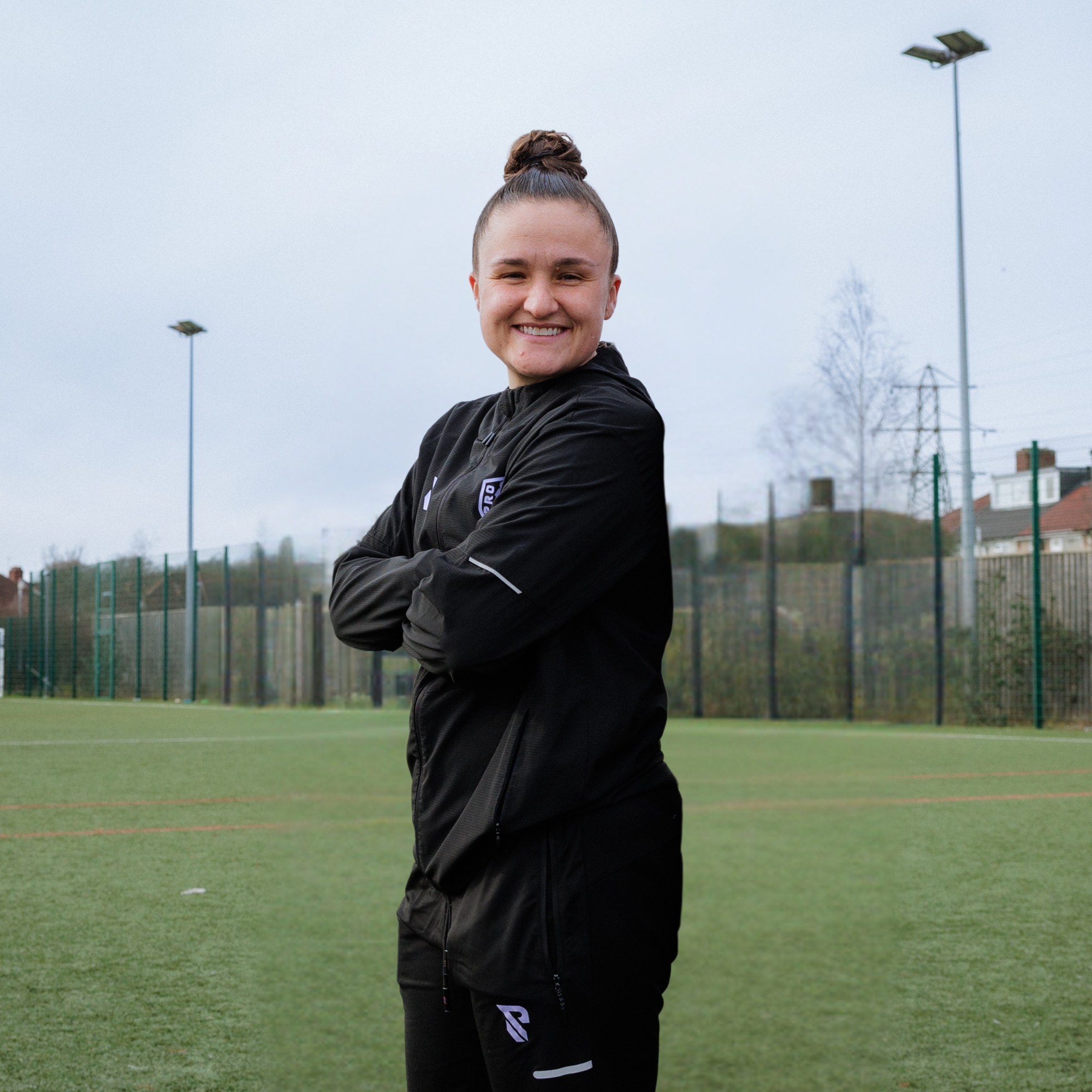 3 girls wearing football kit 